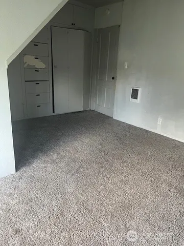 a view of an empty room with a balcony