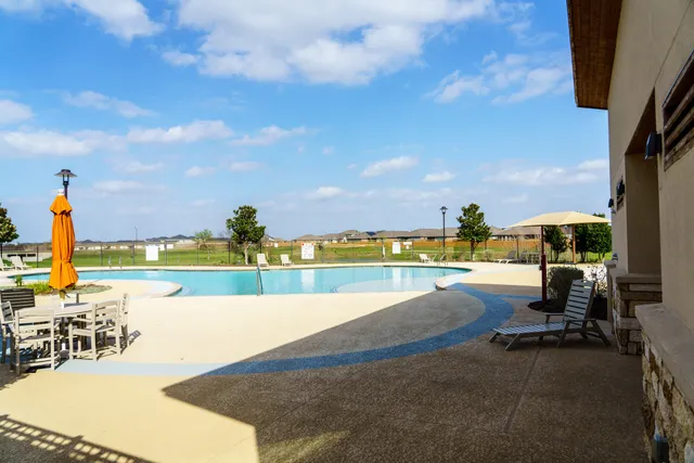 a bathroom with a double vanity sink toilet and shower