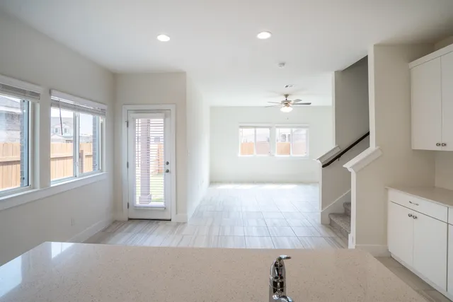 wooden floor in an empty room with a window and wooden floor