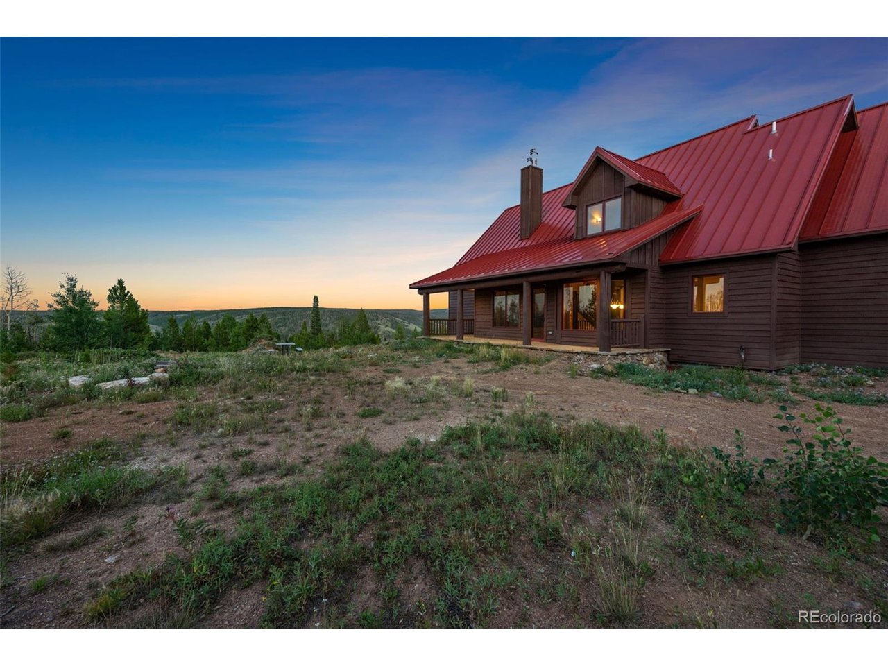 5200 Jackson Road Walden, CO 80480 - Photo 35 of 40 Back porch of cabin and fire pit area