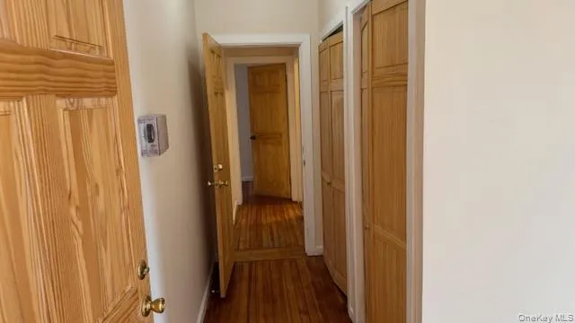 a view of a bathroom from a hallway