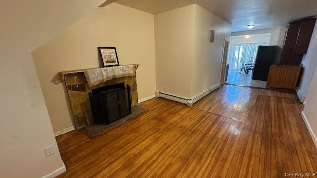 a view of a livingroom with wooden floor