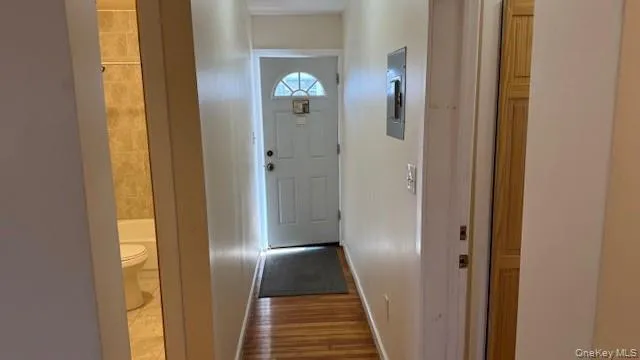 a view of a bathroom from a corridor