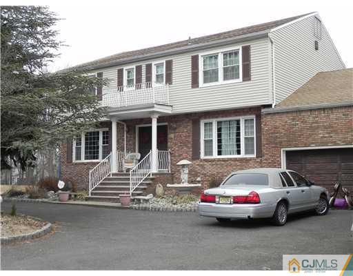 12 Sherwood Road Edison, NJ 08820 - Photo 1 of 23 a front view of a house with parking space