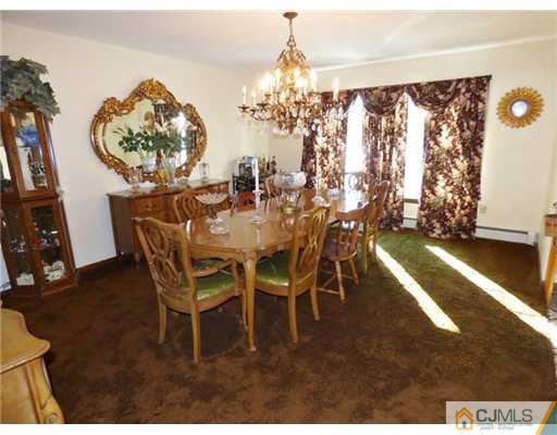 12 Sherwood Road Edison, NJ 08820 - Photo 3 of 23 a view of a dining room with furniture and chandelier