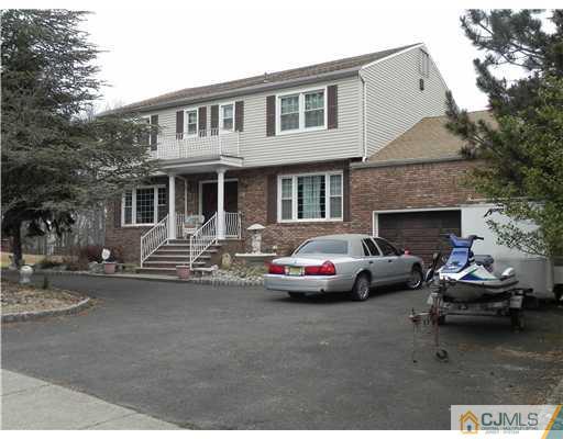 12 Sherwood Road Edison, NJ 08820 - Photo 23 of 23 a couple of cars parked in front of a house