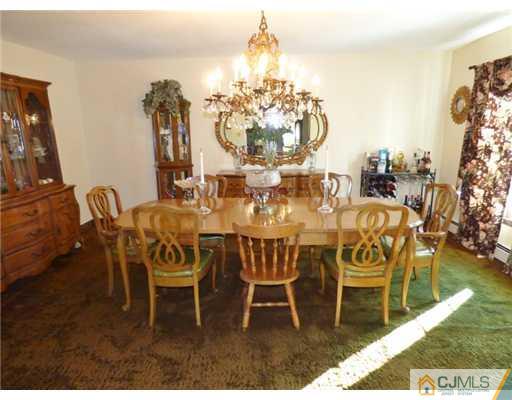 12 Sherwood Road Edison, NJ 08820 - Photo 10 of 23 a view of a dining room with furniture and chandelier