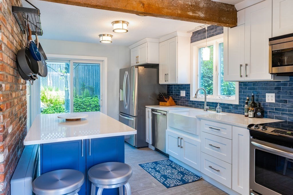 85 Pitman Road Marblehead, MA 01945 - Photo 11 of 27 a kitchen with stainless steel appliances a refrigerator sink and stove