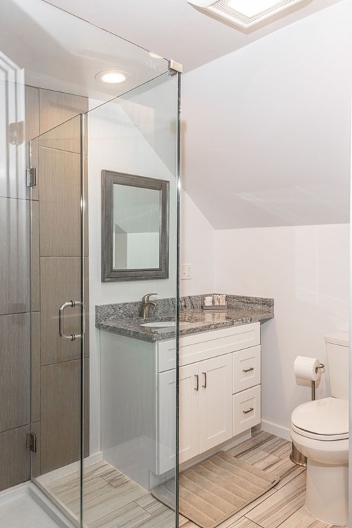 85 Pitman Road Marblehead, MA 01945 - Photo 19 of 27 a bathroom with a granite countertop sink a toilet and shower