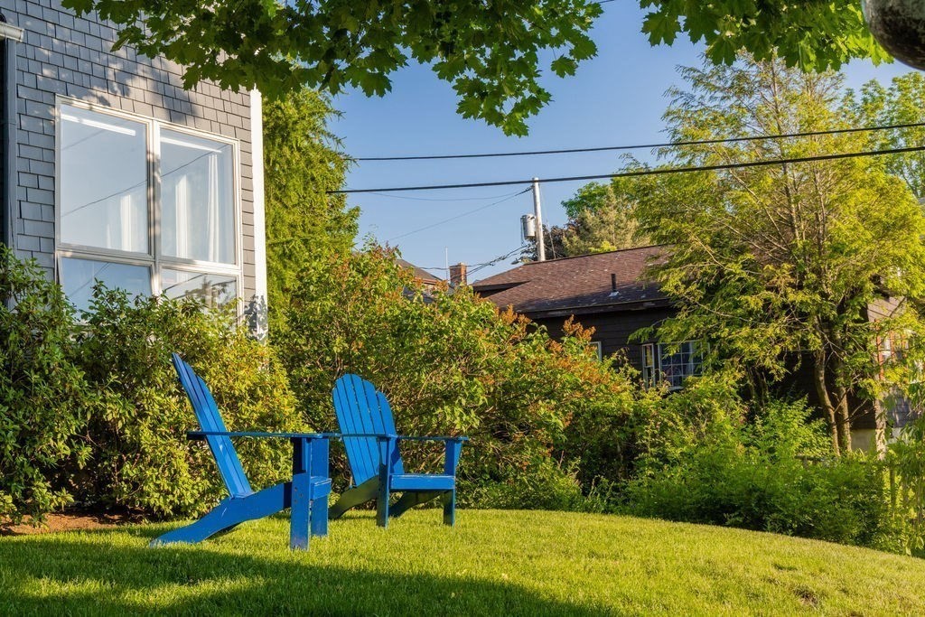 85 Pitman Road Marblehead, MA 01945 - Photo 23 of 27 a backyard of a house with table and chairs