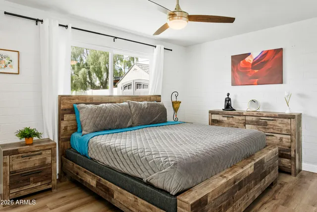 a bedroom with a bed and a window