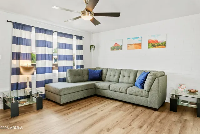 a living room with furniture and a walk in closet