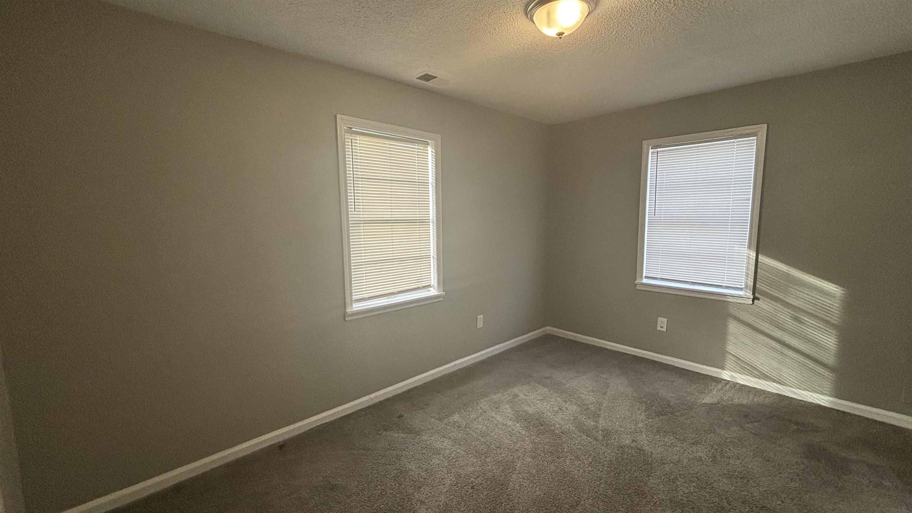 3133 Benjestown Road Memphis, TN 38127 - Photo 5 of 17 an empty room with windows and closet