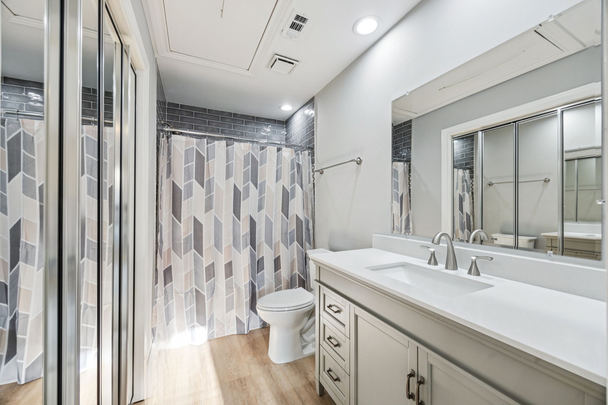 220 East 8th Street Houston, TX 77007 - Photo 24 of 35 a bathroom with a double vanity sink toilet and shower