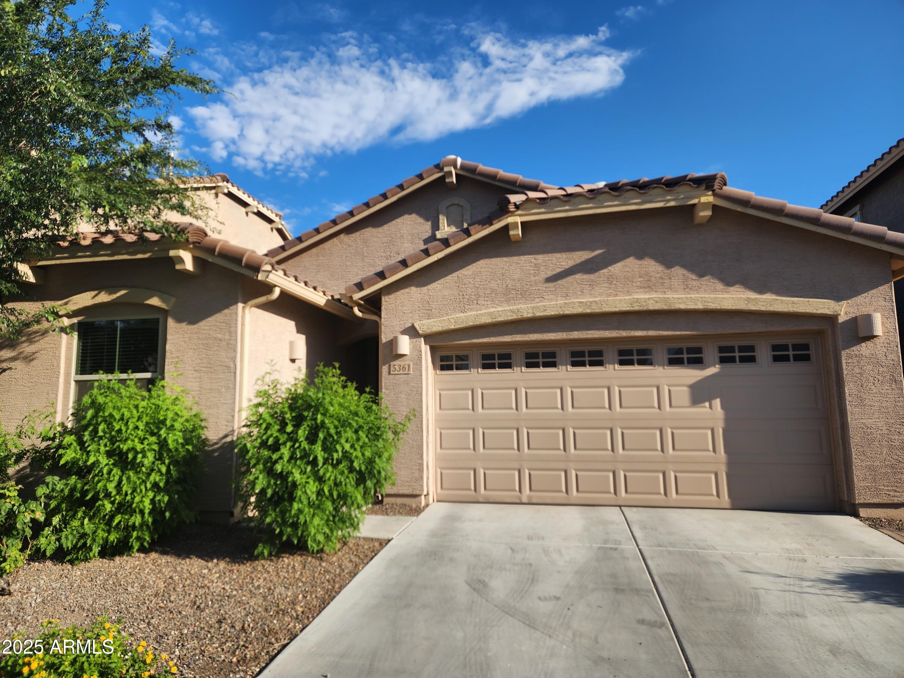 5361 West Desert Hollow Drive Phoenix, AZ 85083 - Photo 1 of 39 a front view of a house with a garden