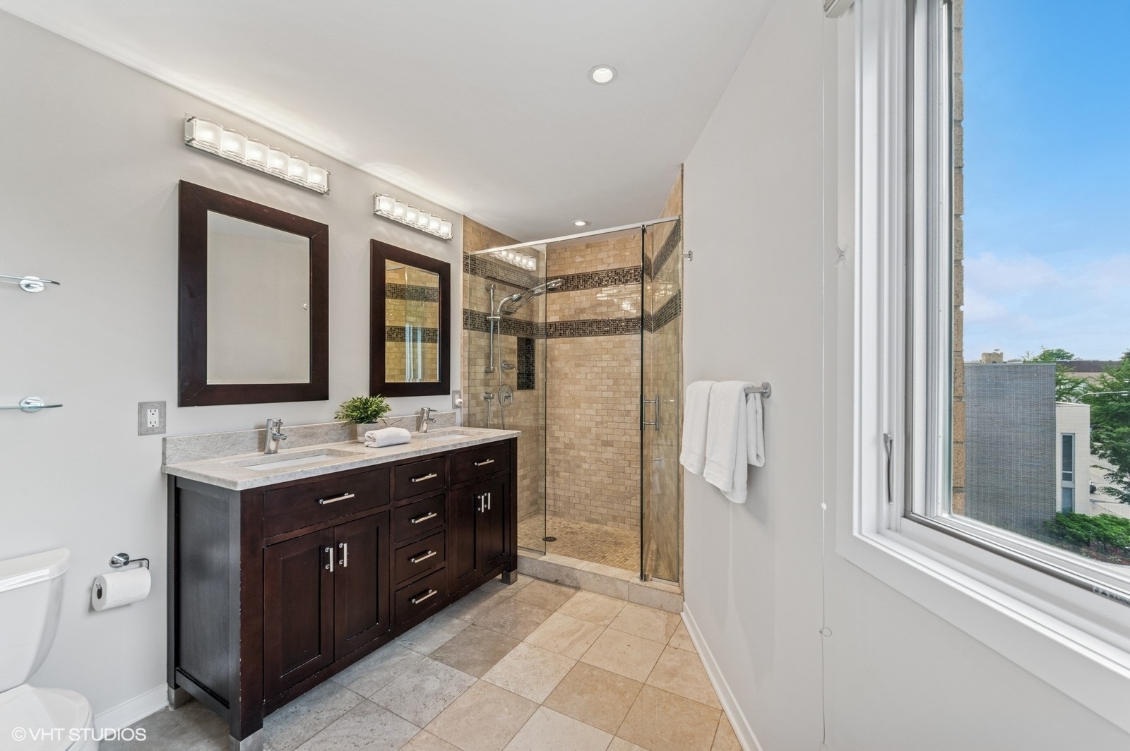 1889 Maple Avenue, Unit W10 Evanston, IL 60201 - Photo 12 of 22 a bathroom with a granite countertop sink mirror and a toilet