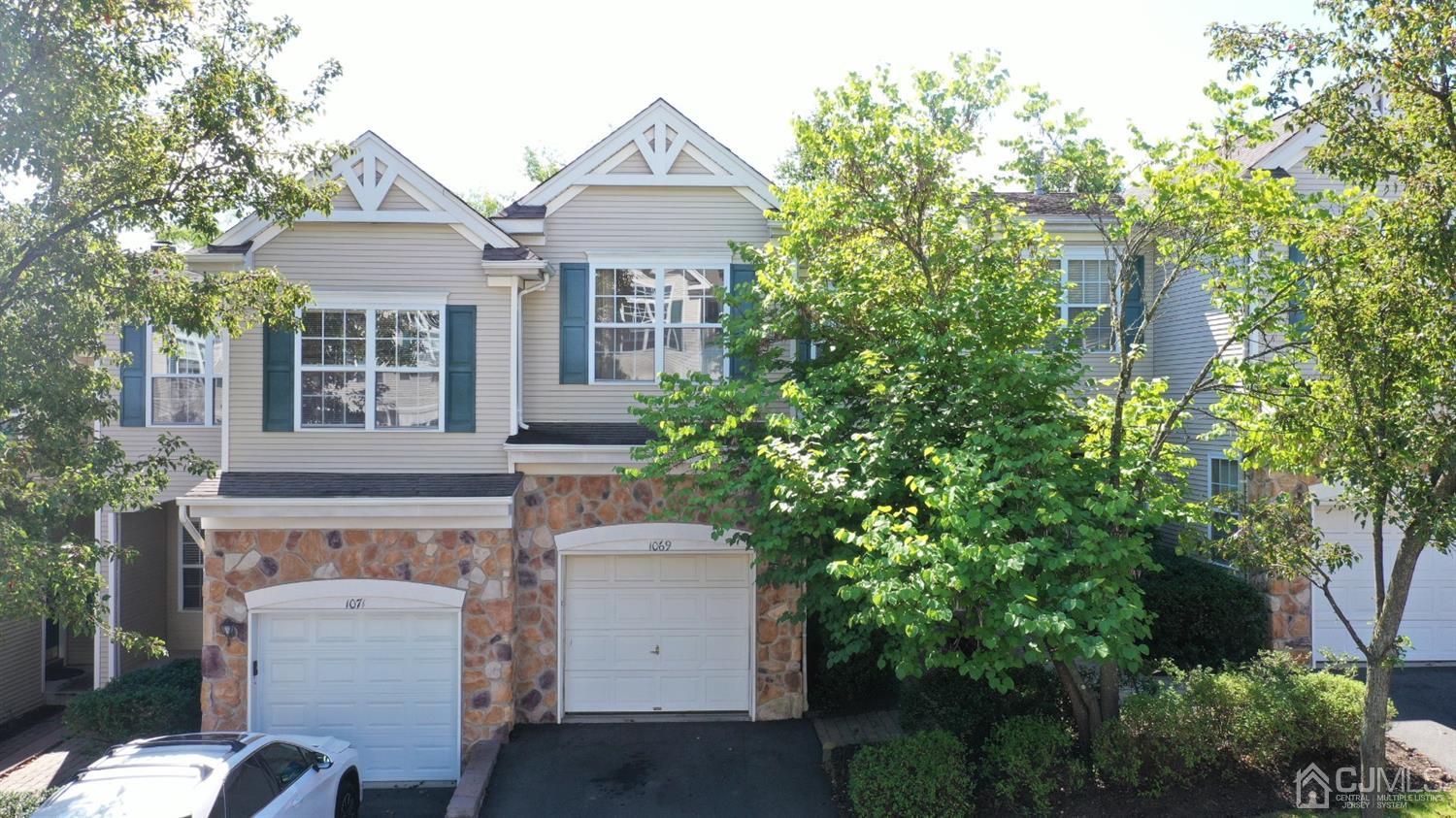 1069 Shadowlawn Drive, Unit 604 Green Brook, NJ 08812 - Photo 1 of 45 a front view of a house with a garden