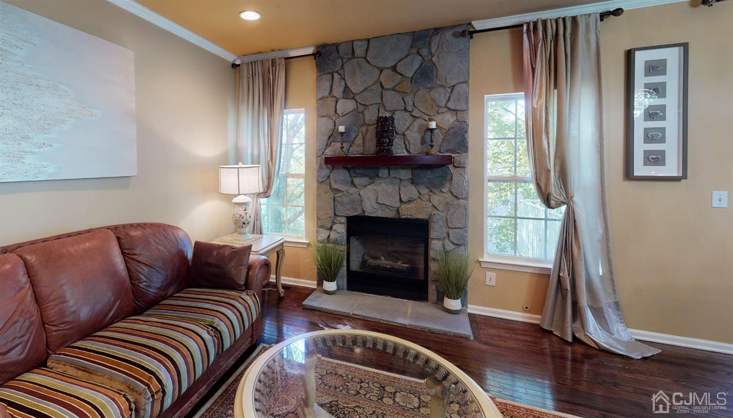 1069 Shadowlawn Drive, Unit 604 Green Brook, NJ 08812 - Photo 12 of 45 a living room with furniture and a fireplace