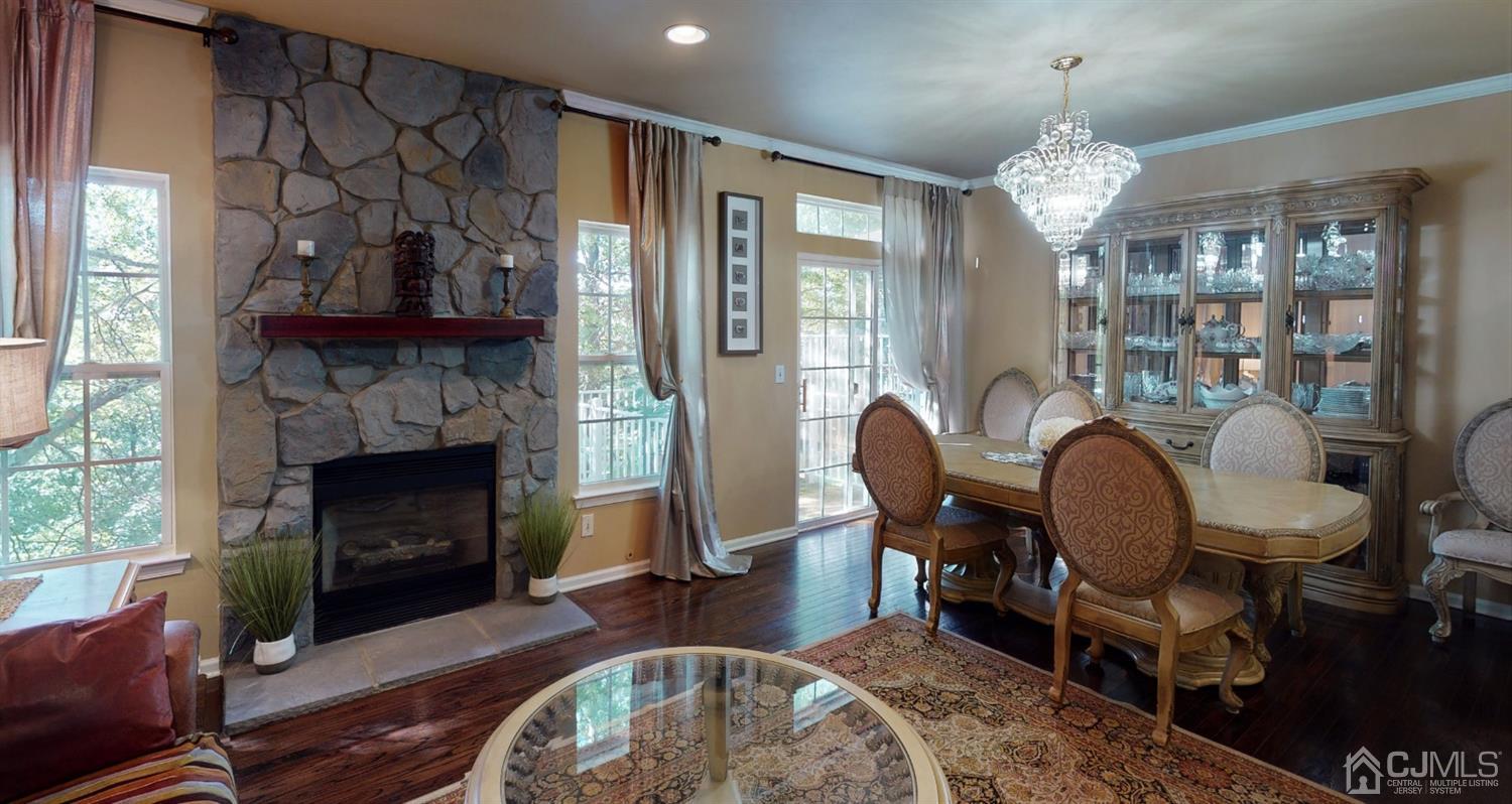 1069 Shadowlawn Drive, Unit 604 Green Brook, NJ 08812 - Photo 13 of 45 a living room with furniture and a fireplace