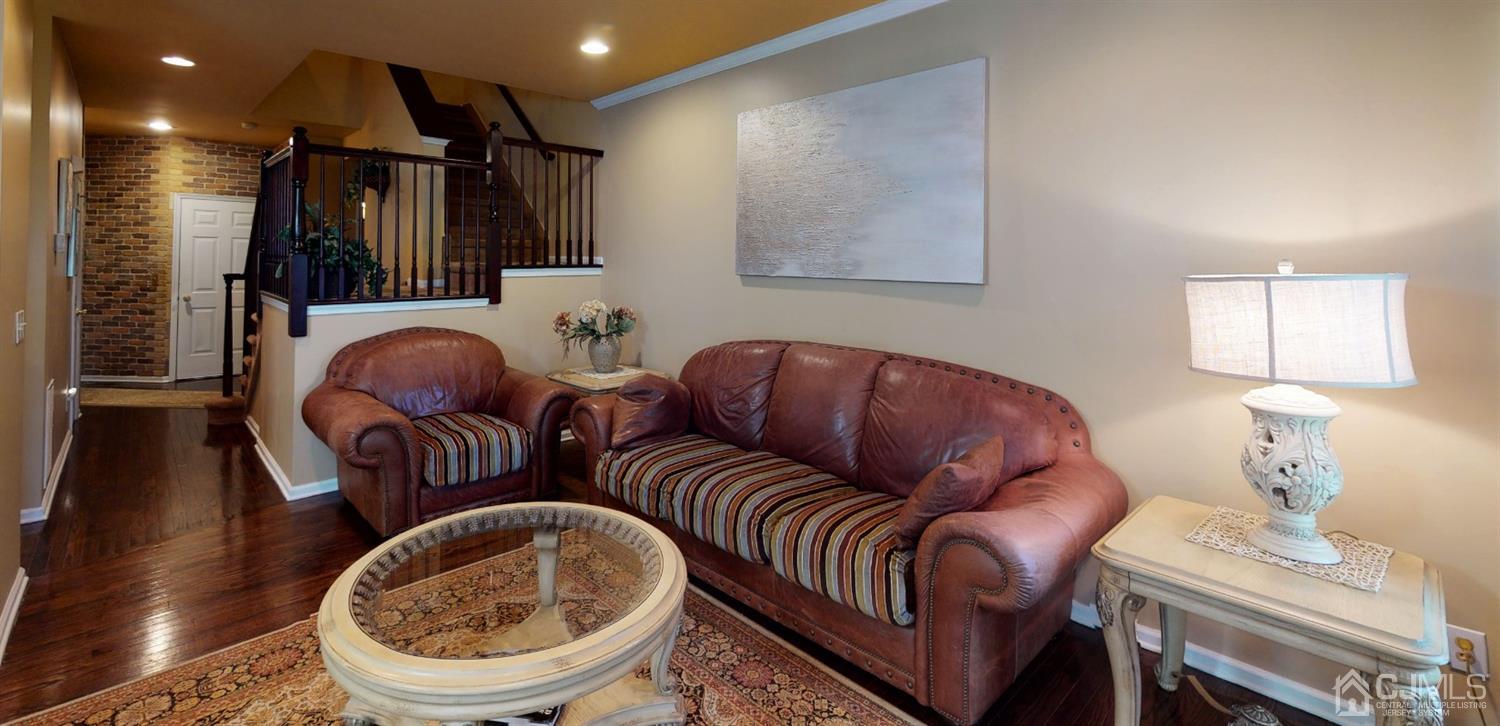 1069 Shadowlawn Drive, Unit 604 Green Brook, NJ 08812 - Photo 16 of 45 a living room with furniture and a lamp