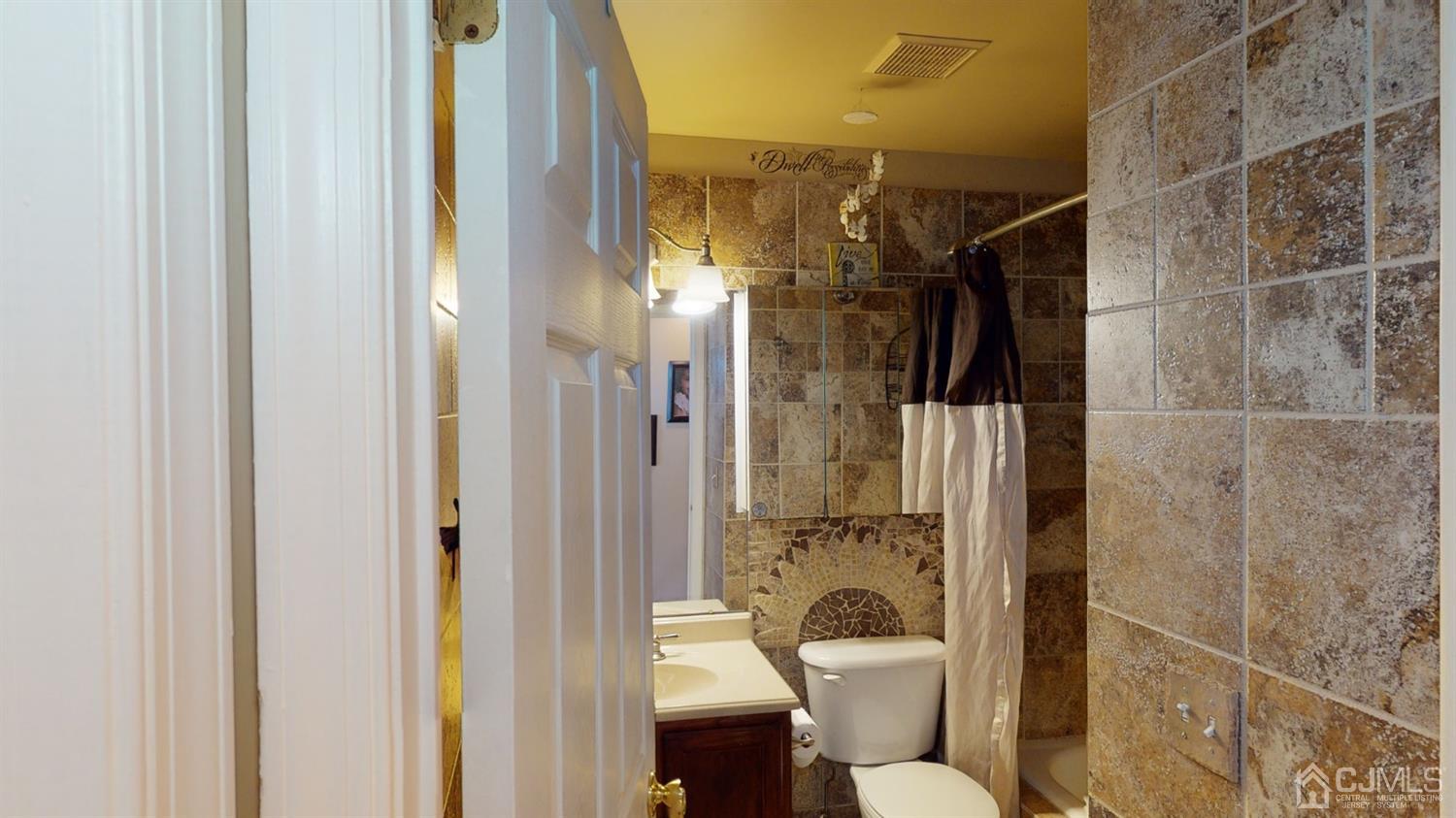 1069 Shadowlawn Drive, Unit 604 Green Brook, NJ 08812 - Photo 30 of 45 a bathroom with a toilet and a shower