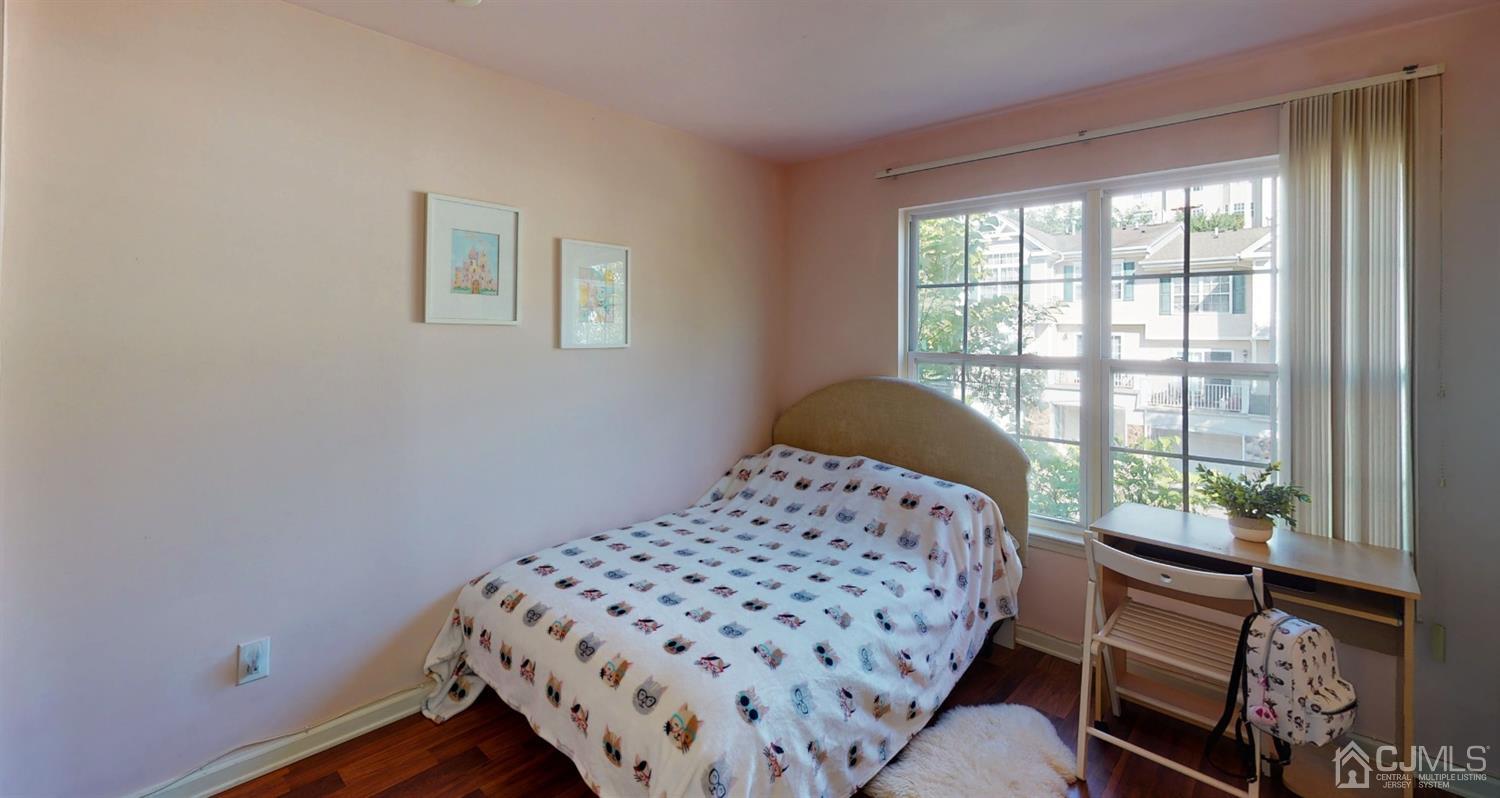 1069 Shadowlawn Drive, Unit 604 Green Brook, NJ 08812 - Photo 34 of 45 a bedroom with a bed and a window