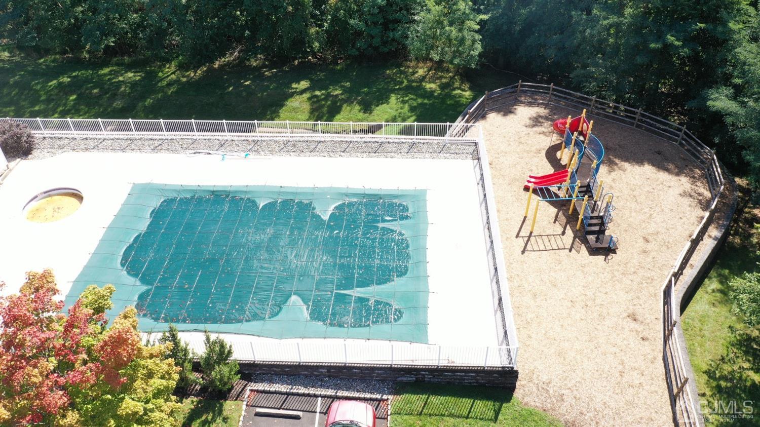 1069 Shadowlawn Drive, Unit 604 Green Brook, NJ 08812 - Photo 42 of 45 a view of swimming pool with a yard
