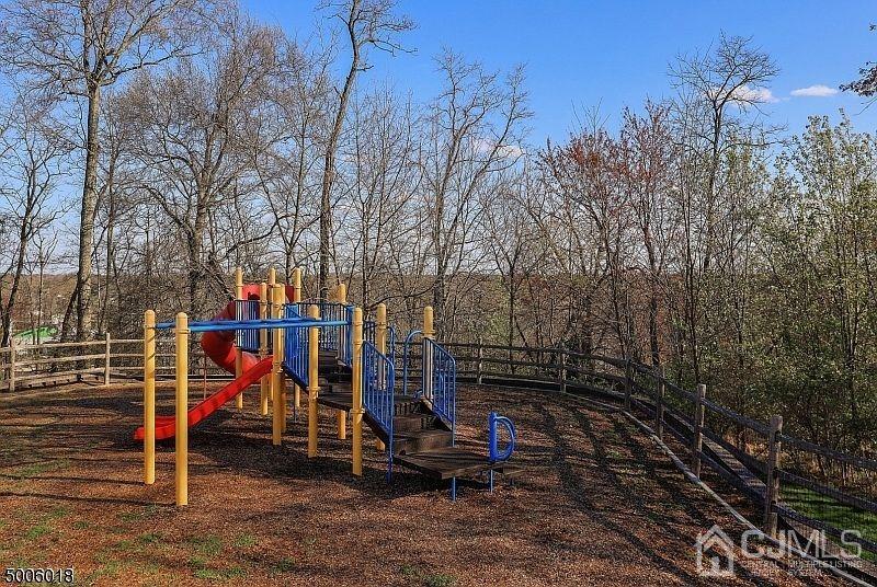 1069 Shadowlawn Drive, Unit 604 Green Brook, NJ 08812 - Photo 45 of 45 a view of outdoor space with deck and tree