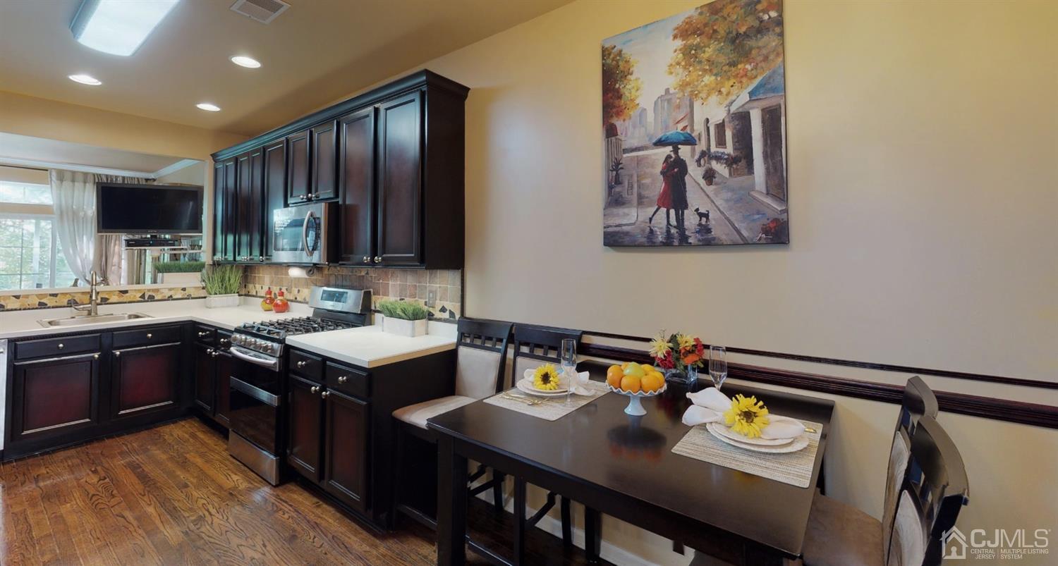 1069 Shadowlawn Drive, Unit 604 Green Brook, NJ 08812 - Photo 9 of 45 a kitchen with a sink cabinets and counter space