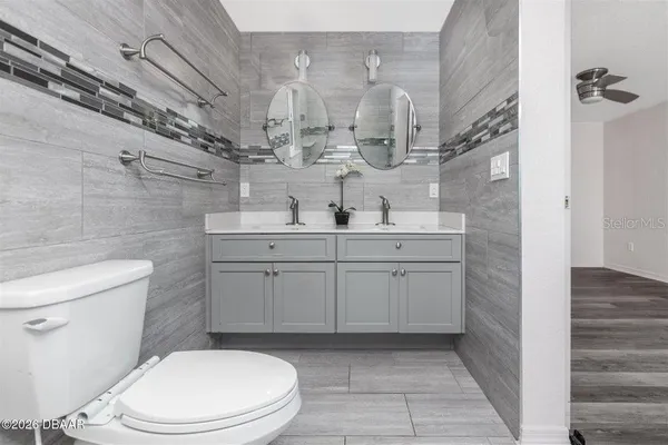 a bathroom with a glass door shower