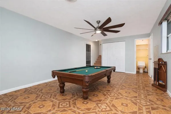 a view of a hallway with a chandelier