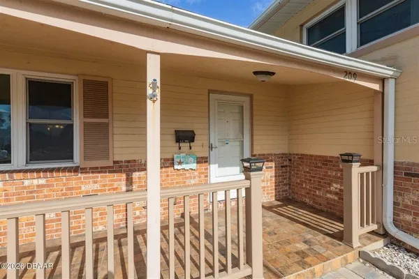 a view of hallway with wooden floor