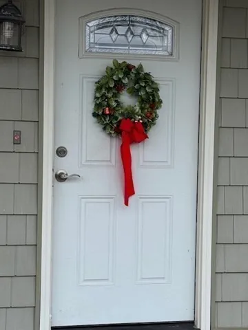 a vase of flowers sitting on a bathroom