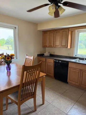 a kitchen with a stove a sink and a refrigerator