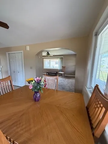 a bedroom with a bed and a large mirror