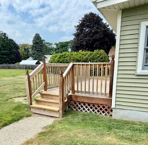 a view of a deck with a white fence