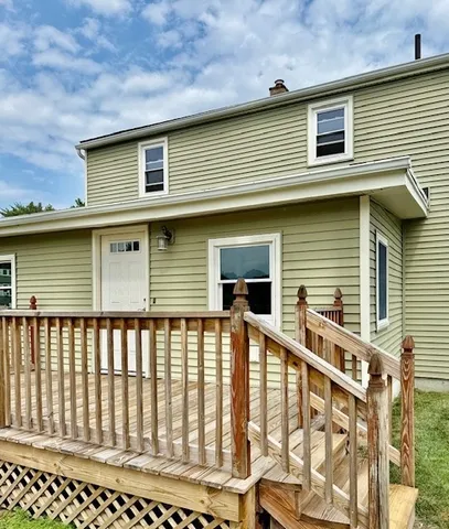a front view of a house with large windows