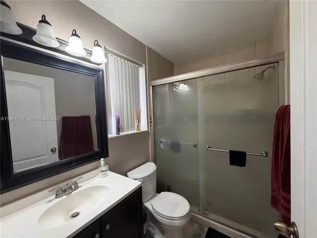 a bathroom with a shower and a toilet