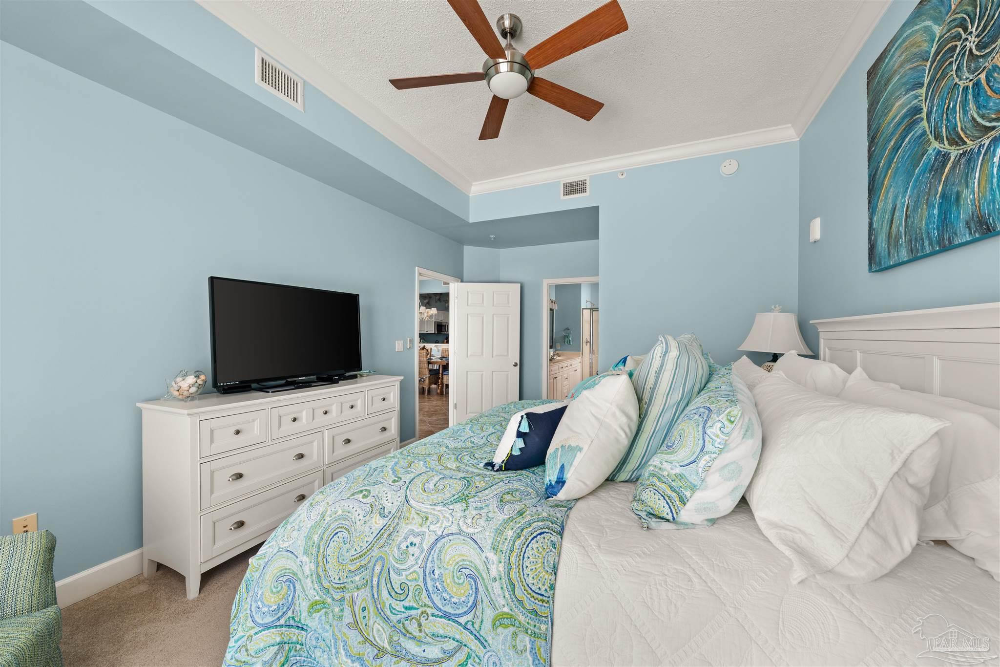 14511 Perdido Key Drive, Unit 508 Perdido Key, FL 32507 - Photo 21 of 59 a bedroom with a bed and a flat screen tv