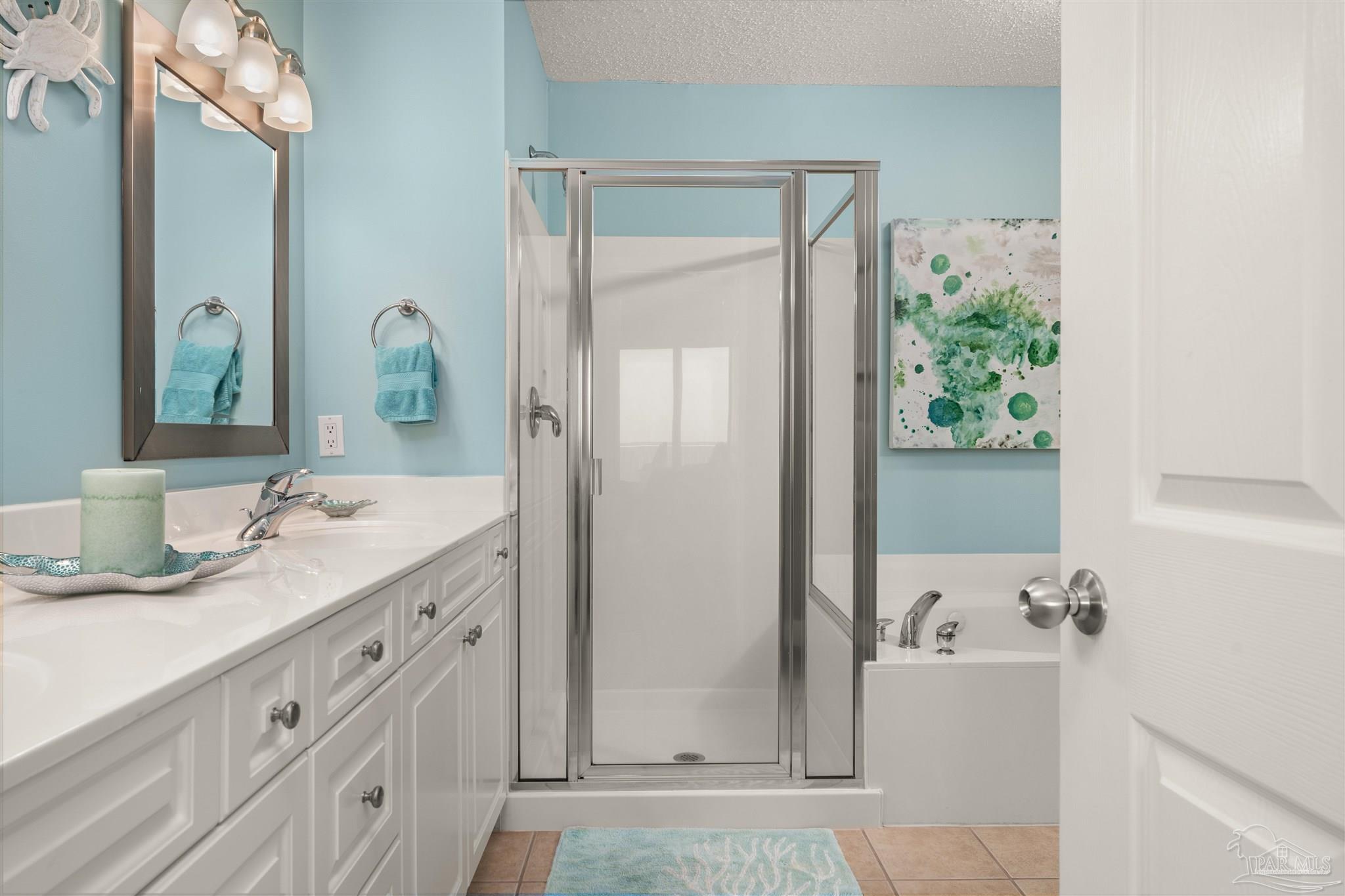 14511 Perdido Key Drive, Unit 508 Perdido Key, FL 32507 - Photo 22 of 59 a bathroom with a granite countertop sink and a mirror