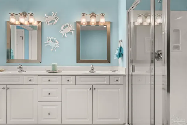 a spacious bedroom with a bed and a flat screen tv