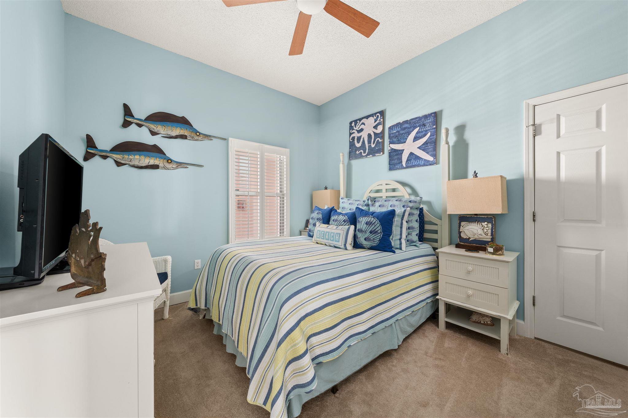 14511 Perdido Key Drive, Unit 508 Perdido Key, FL 32507 - Photo 26 of 59 a bedroom with a bed and a flat screen tv