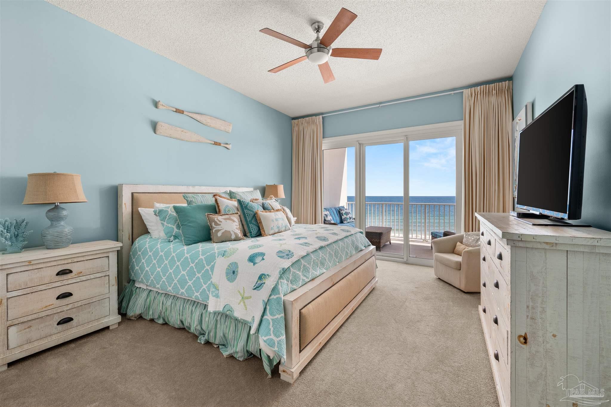 14511 Perdido Key Drive, Unit 508 Perdido Key, FL 32507 - Photo 29 of 59 a spacious bedroom with a bed and a flat screen tv
