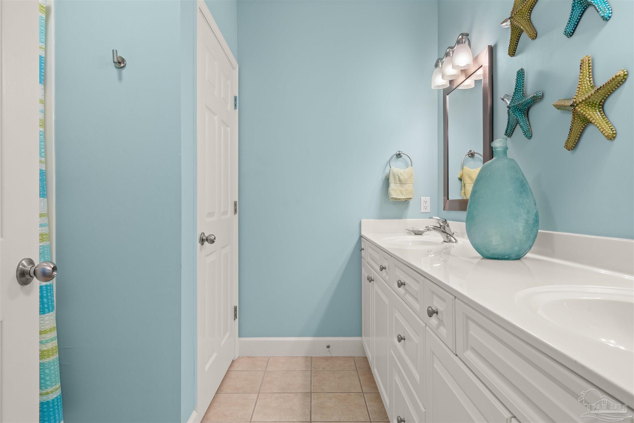 14511 Perdido Key Drive, Unit 508 Perdido Key, FL 32507 - Photo 31 of 59 a bathroom with a sink and a mirror