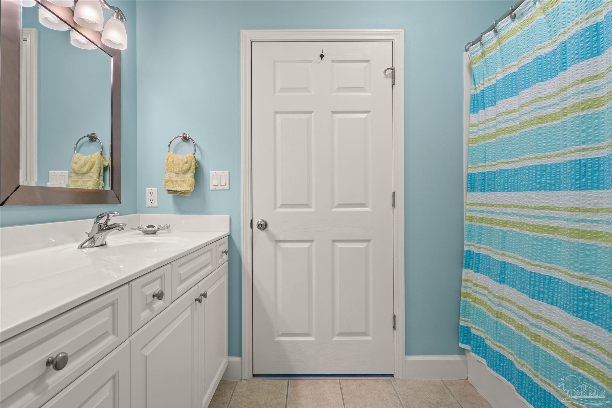 14511 Perdido Key Drive, Unit 508 Perdido Key, FL 32507 - Photo 32 of 59 a bathroom with a sink and a mirror