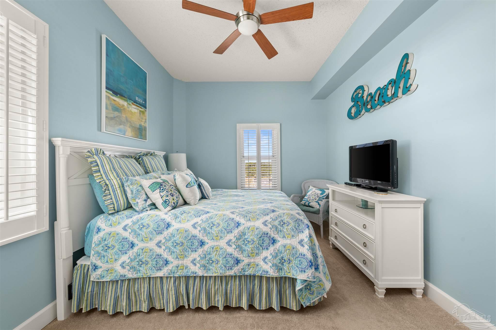 14511 Perdido Key Drive, Unit 508 Perdido Key, FL 32507 - Photo 35 of 59 a bedroom with a bed and a television