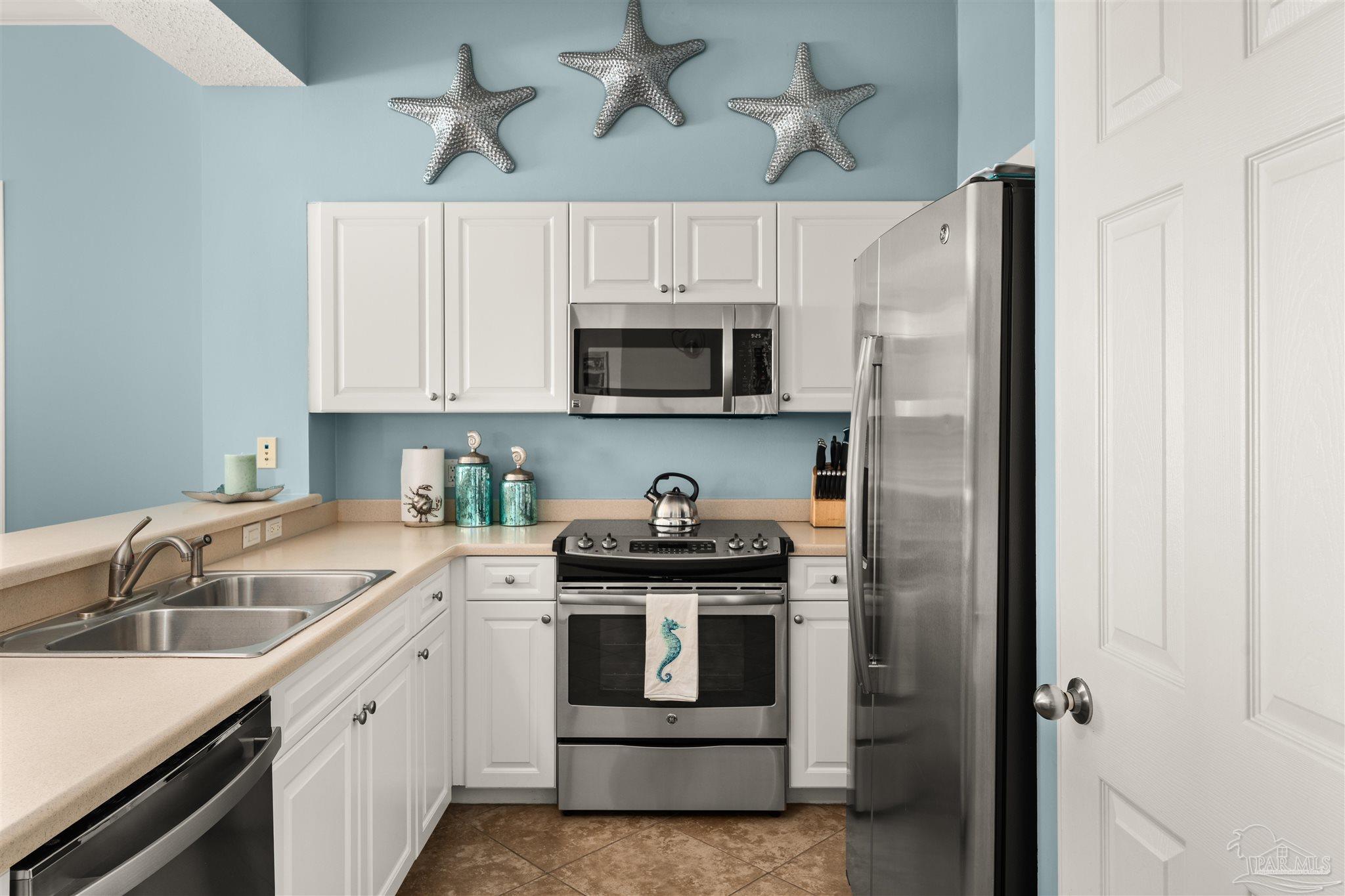 14511 Perdido Key Drive, Unit 508 Perdido Key, FL 32507 - Photo 6 of 59 a kitchen with a sink stove and microwave