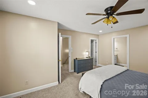 a bedroom with furniture and window