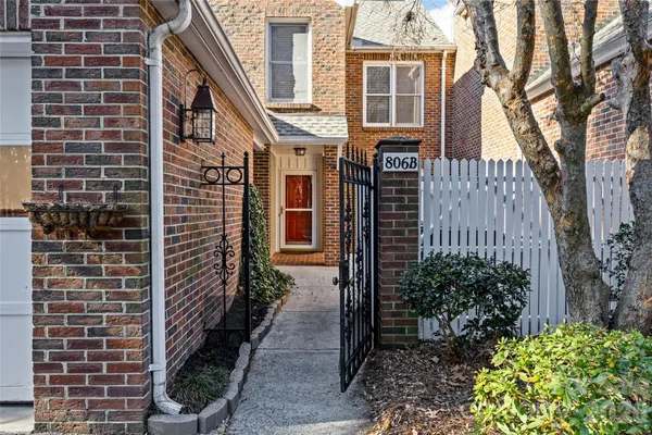 a view of a brick buildings with an outdoor space