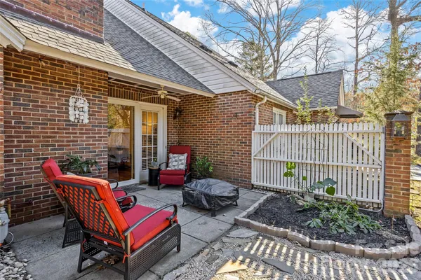 a backyard of a house with outdoor seating